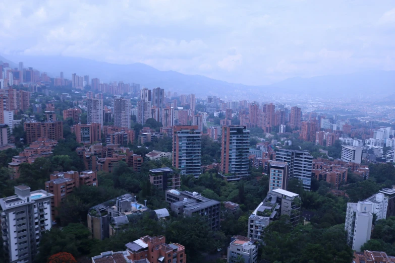 a large city is surrounded by some hills