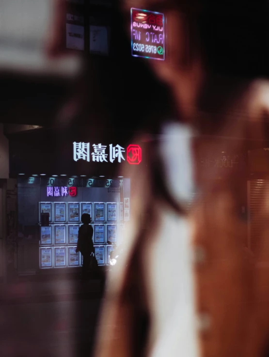 a man is standing outside the subway entrance