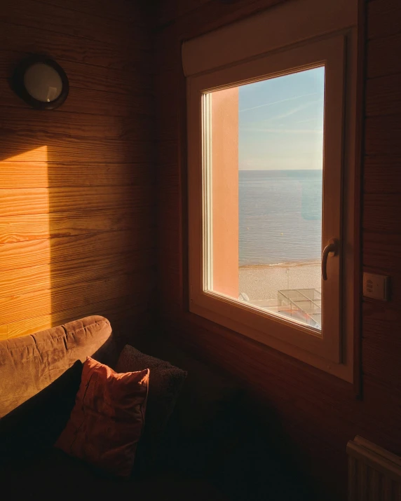 the sun shines on the wall and casts shadows on a wood panelled wall