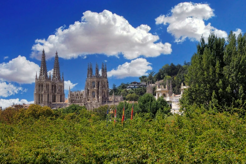 large cathedrals and towers surrounded by many trees