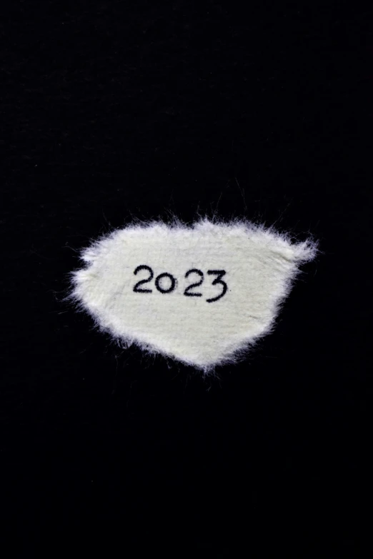 a white object with a black background in the year 205