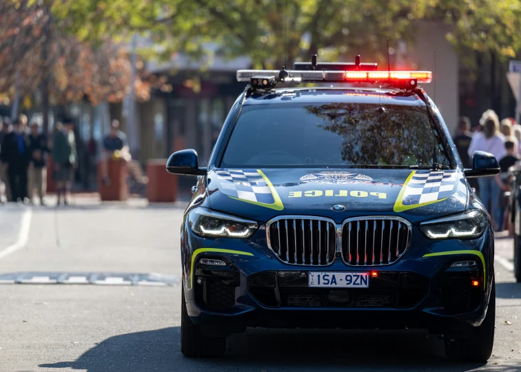 the police car is equipped with its lights on