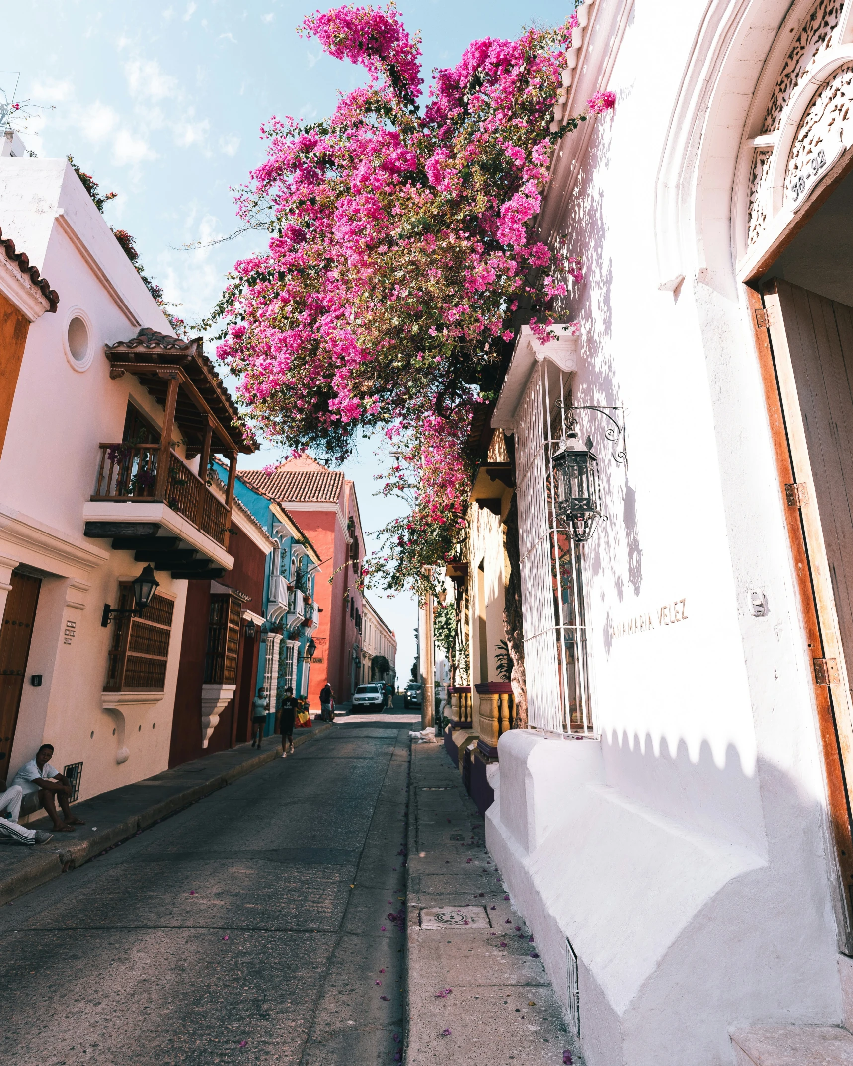 the sun shines on an empty city street