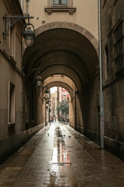 a very narrow and dirty street with dles