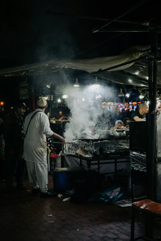 two chef cooks in front of several people