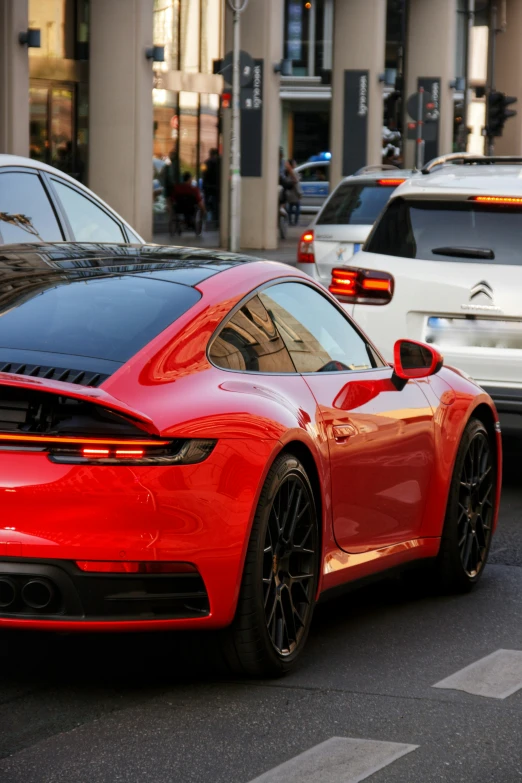 the rear of a red car with black rims