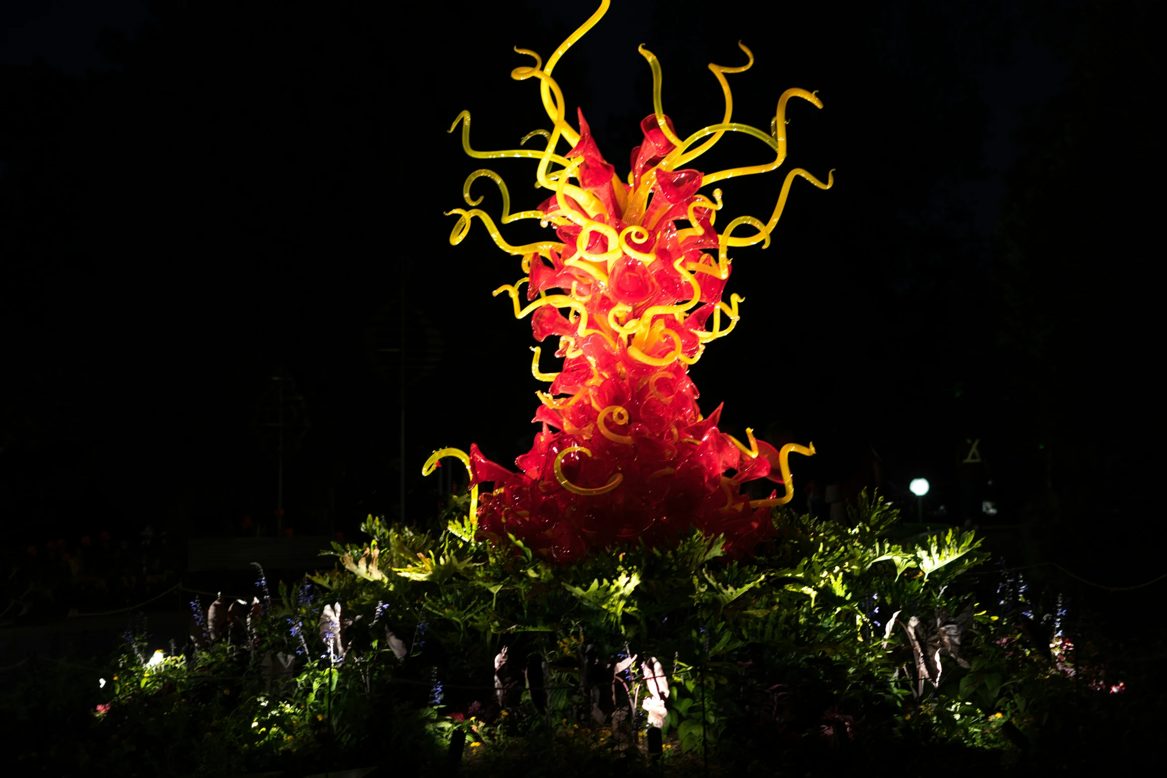 a glowing fire hydrant in front of a tree