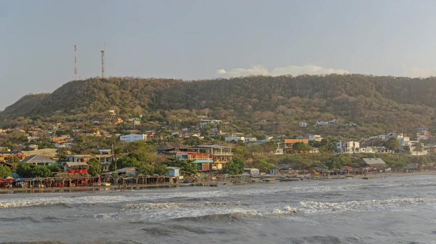 view of water and city near shore on hillside