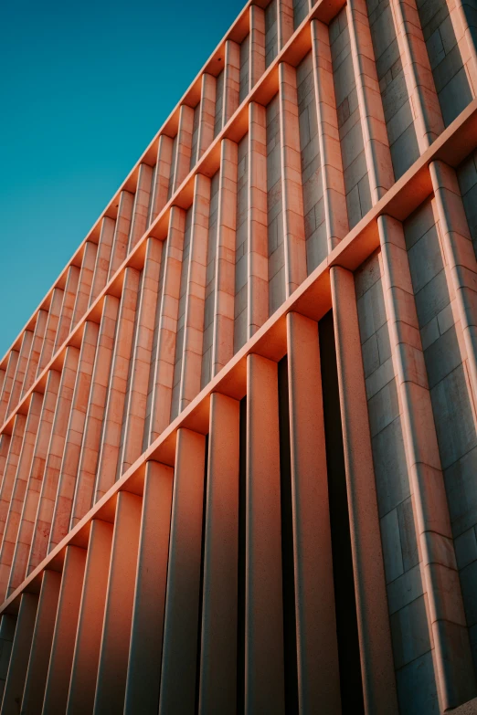 the underside view of the building, of steel bars and the side of it