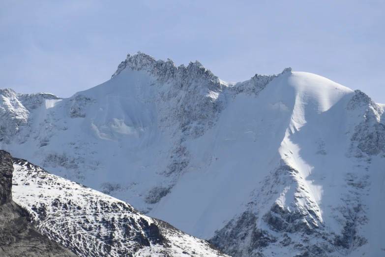 the snow - capped mountains of this region give snow and cloud formations