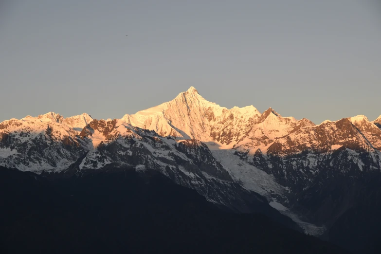 a close up of some mountains with snow