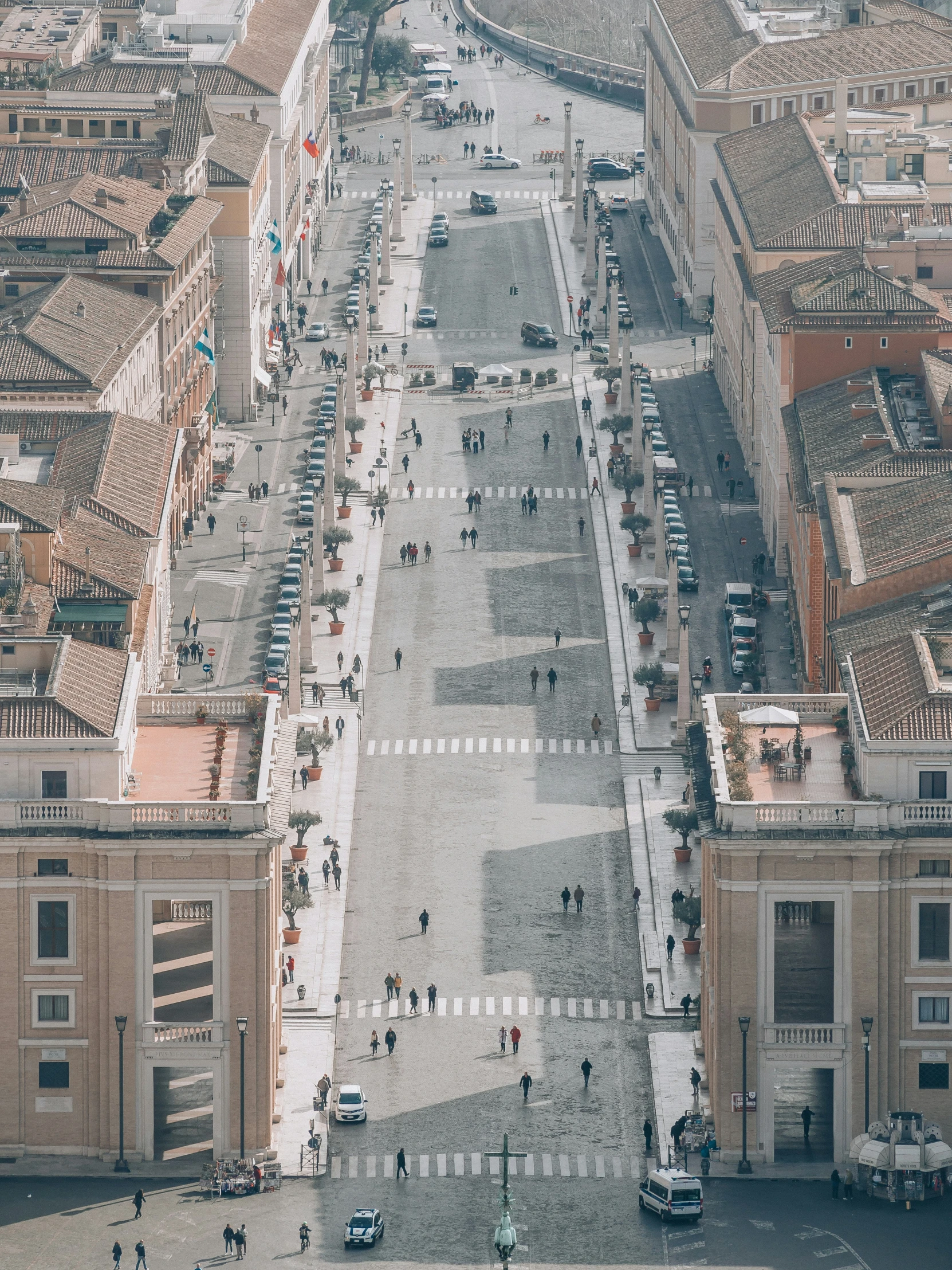 an aerial view of several buildings and people