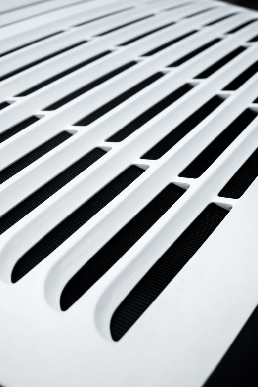 vented metal grille of a vehicle close up