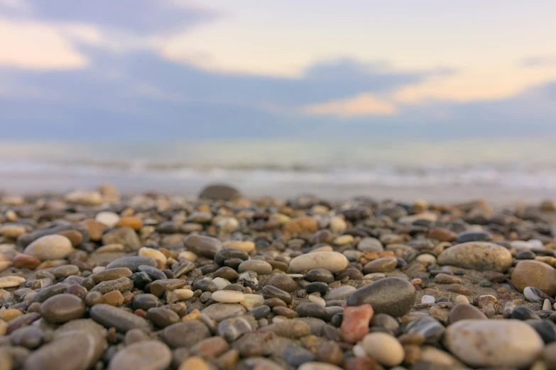 gravel and rocks under a cloudy blue sky