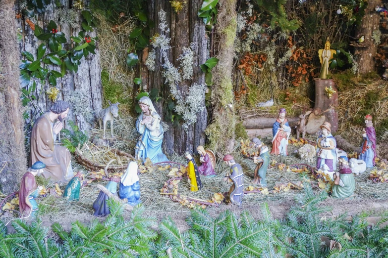 a bunch of statues on a large tree