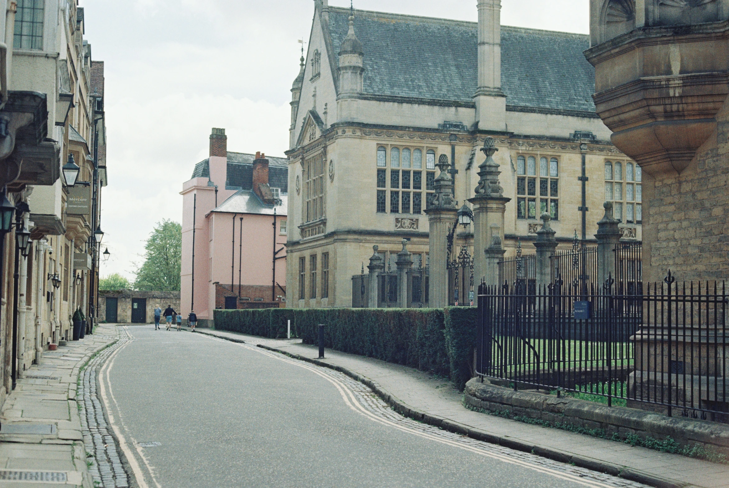 an old looking street near some very pretty buildings