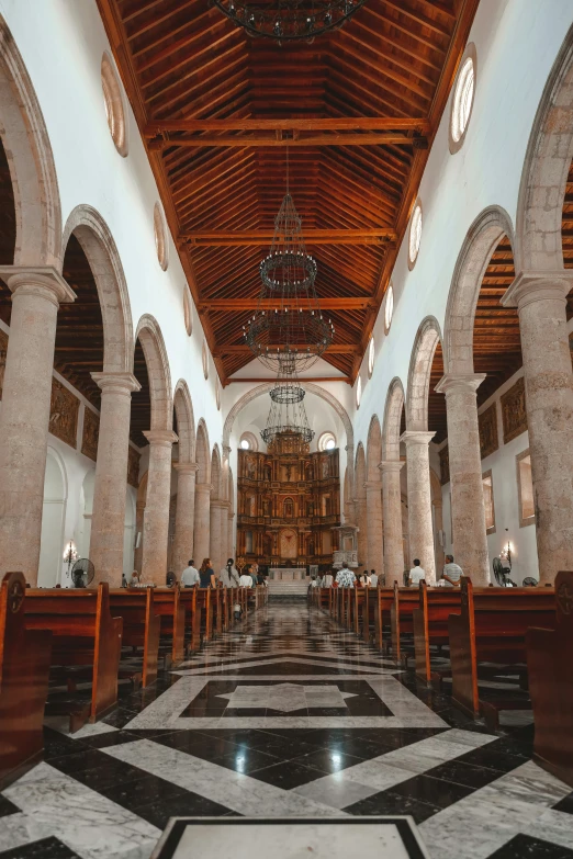 inside view of an old church with black and white tile