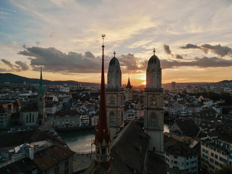 a very tall clock tower next to a river