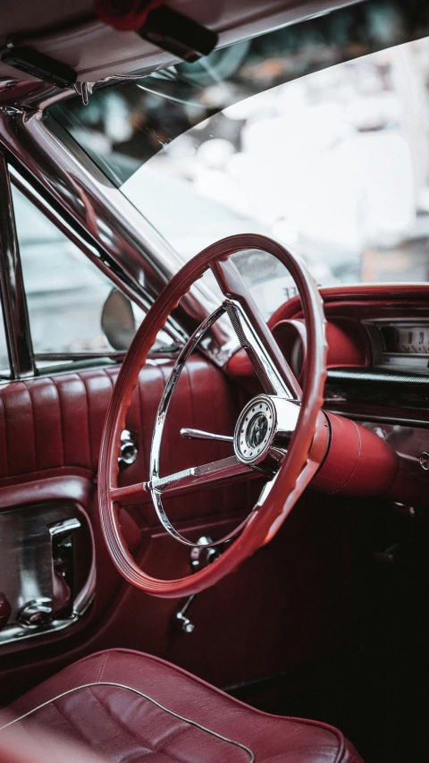 the inside of a car with a steering wheel