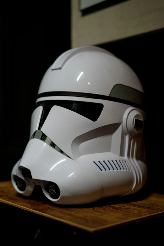 a stormtrooper helmet sits on a table