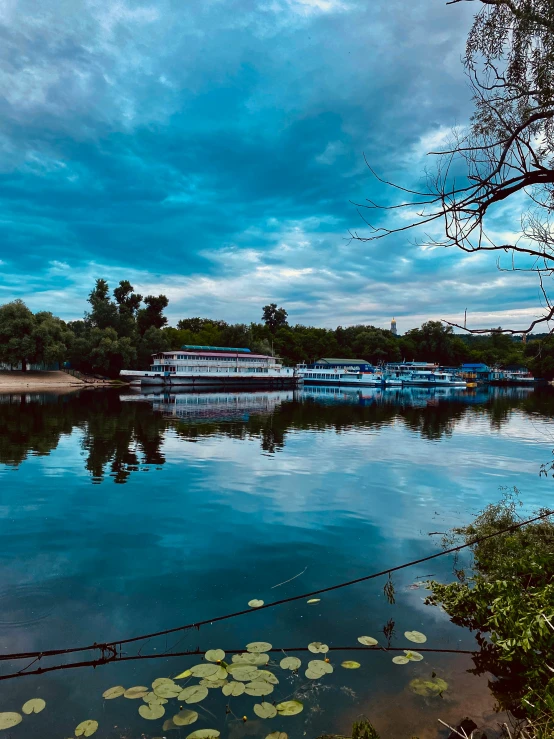 a lake that is surrounded by small boats