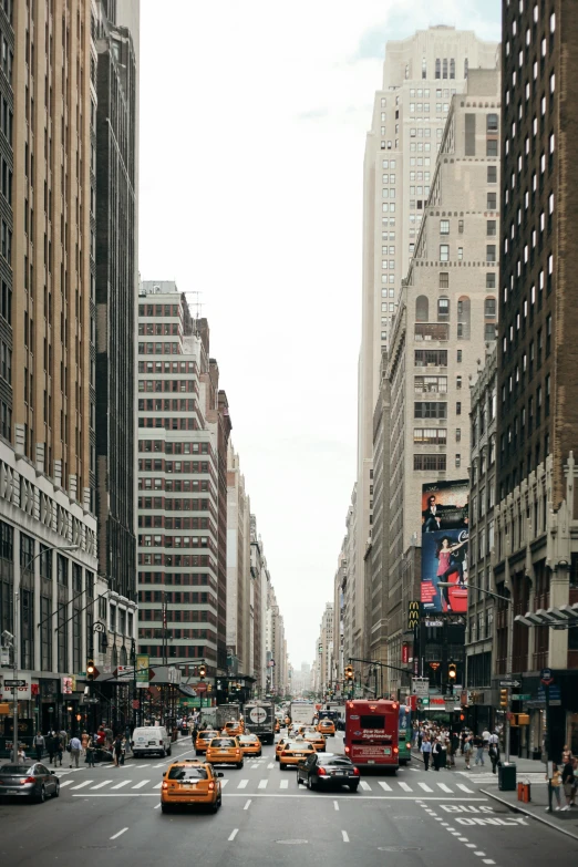 cars and cabs on street in urban city