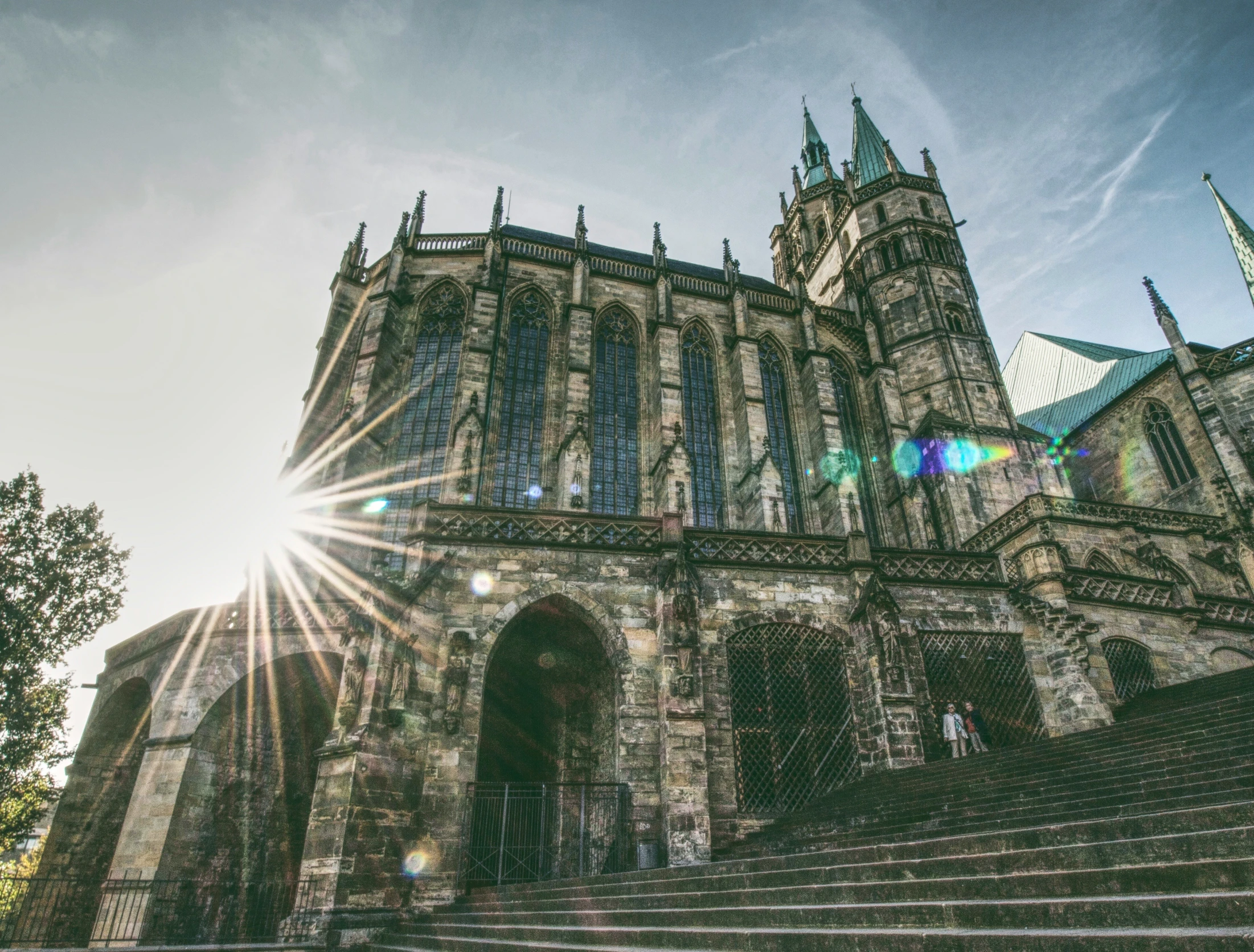 the front of a gothic church on a sunny day