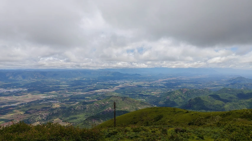 the view from atop the mountain of a large valley