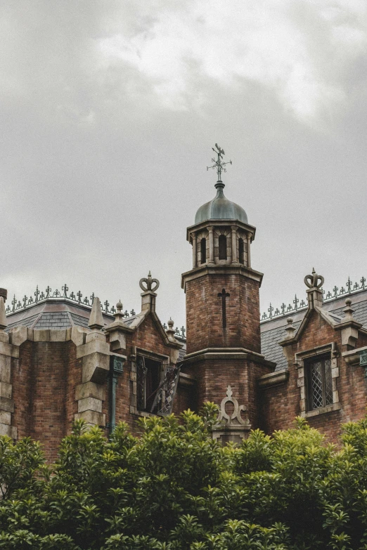 a large brick building with a clock on the top