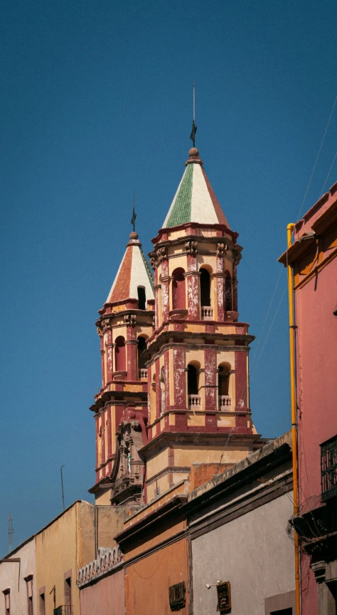 a very large church with three towers on a hill