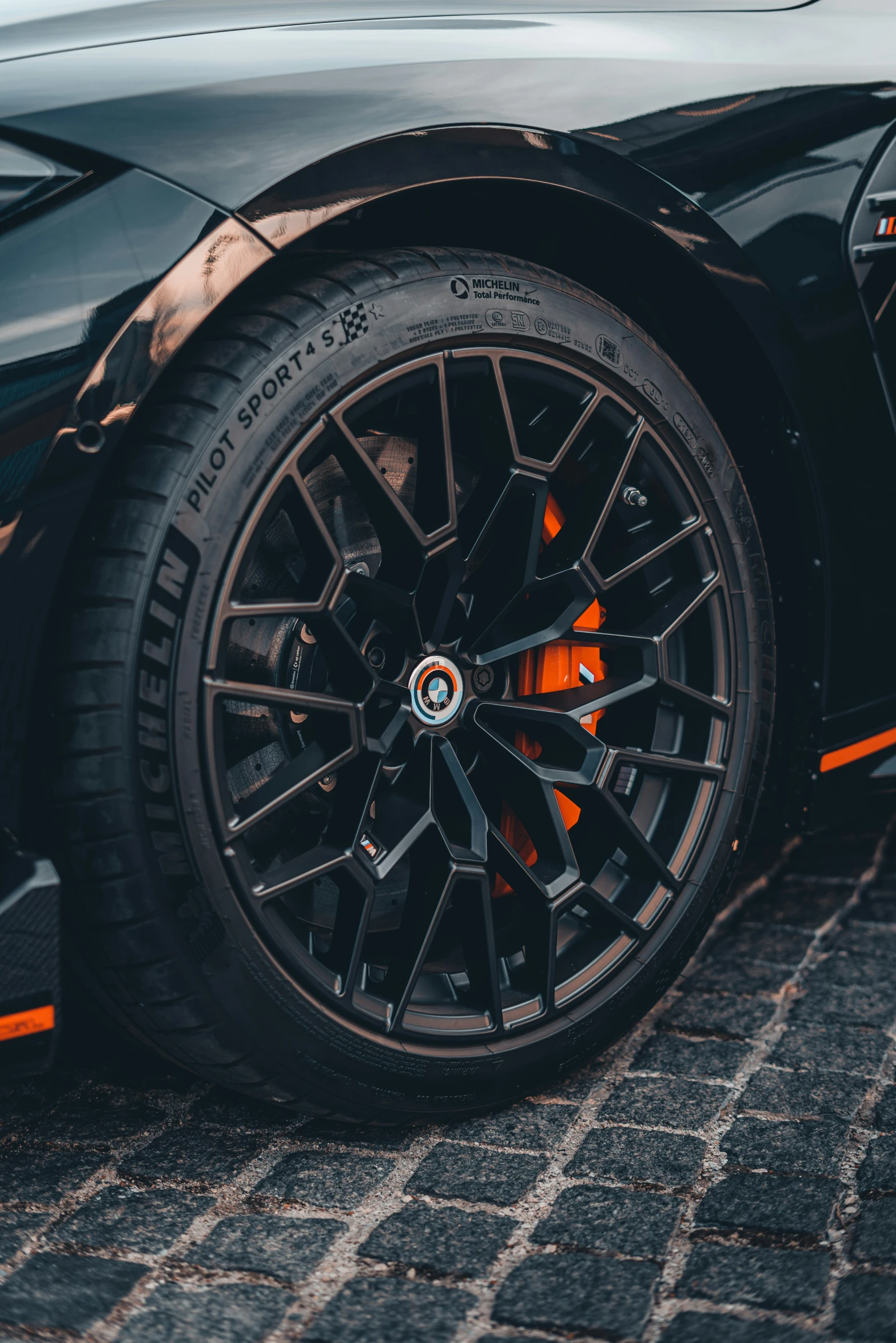 the black rims of the car are shown