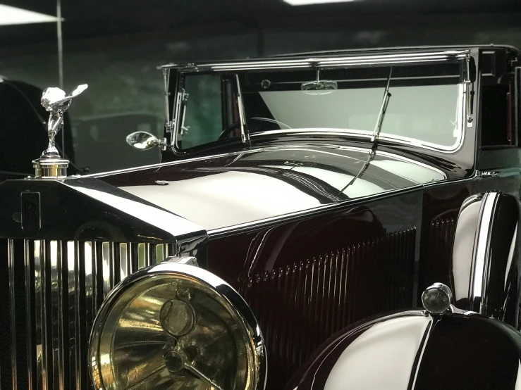 an old model t car parked in front of a building