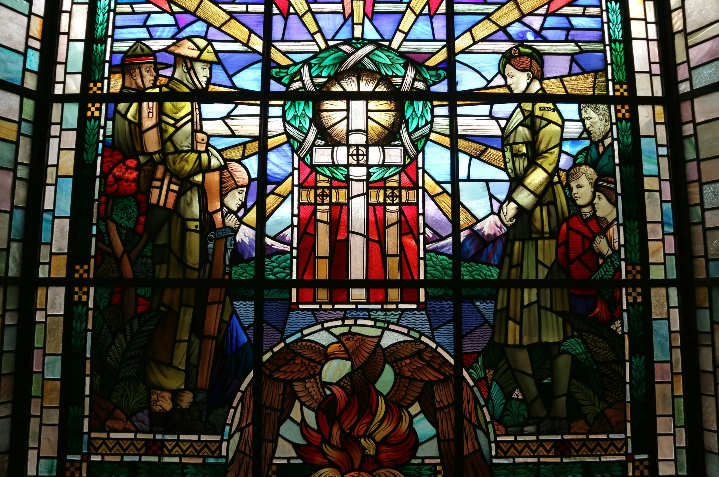 an artistic, stained glass window with a religious figure