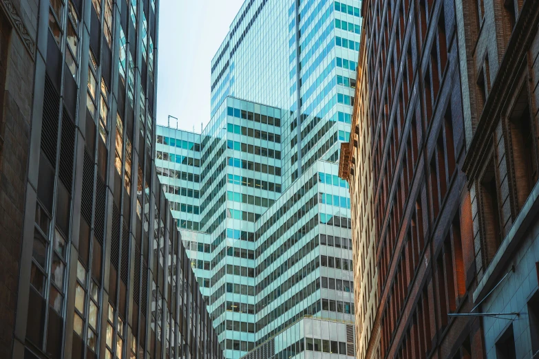 the view of a couple of tall buildings on a city street