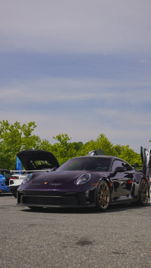 a couple of black cars are parked next to each other