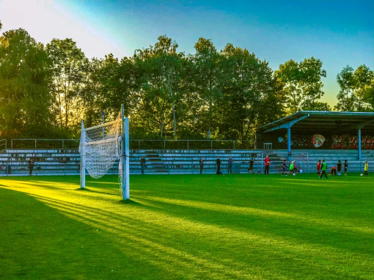 several players are in action on the soccer field