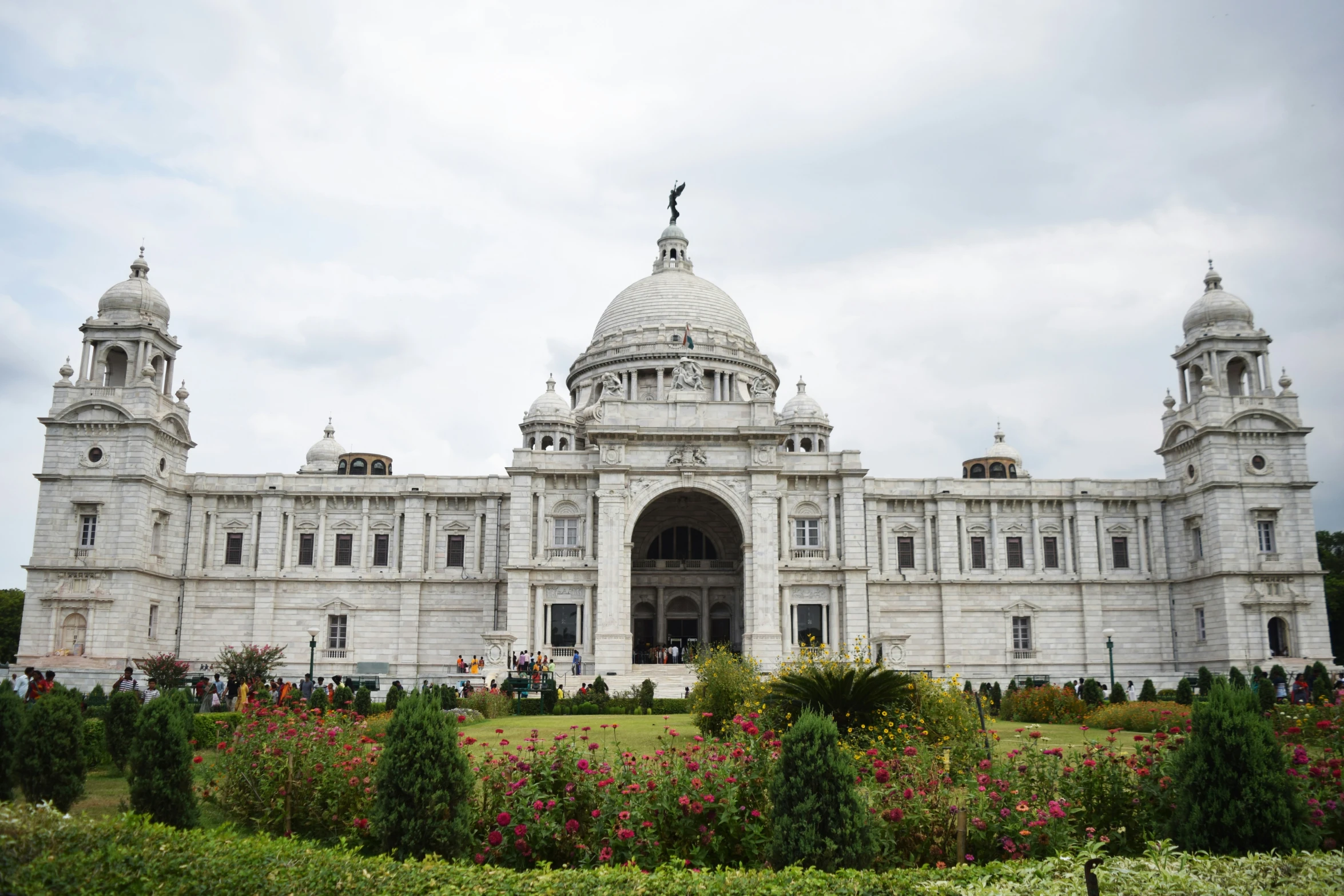 large building with two statues in the middle