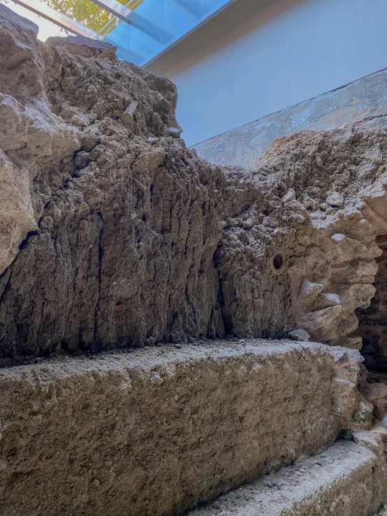 there is snow and rocks in the indoor display