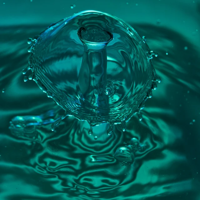 a glass of water that is floating in it