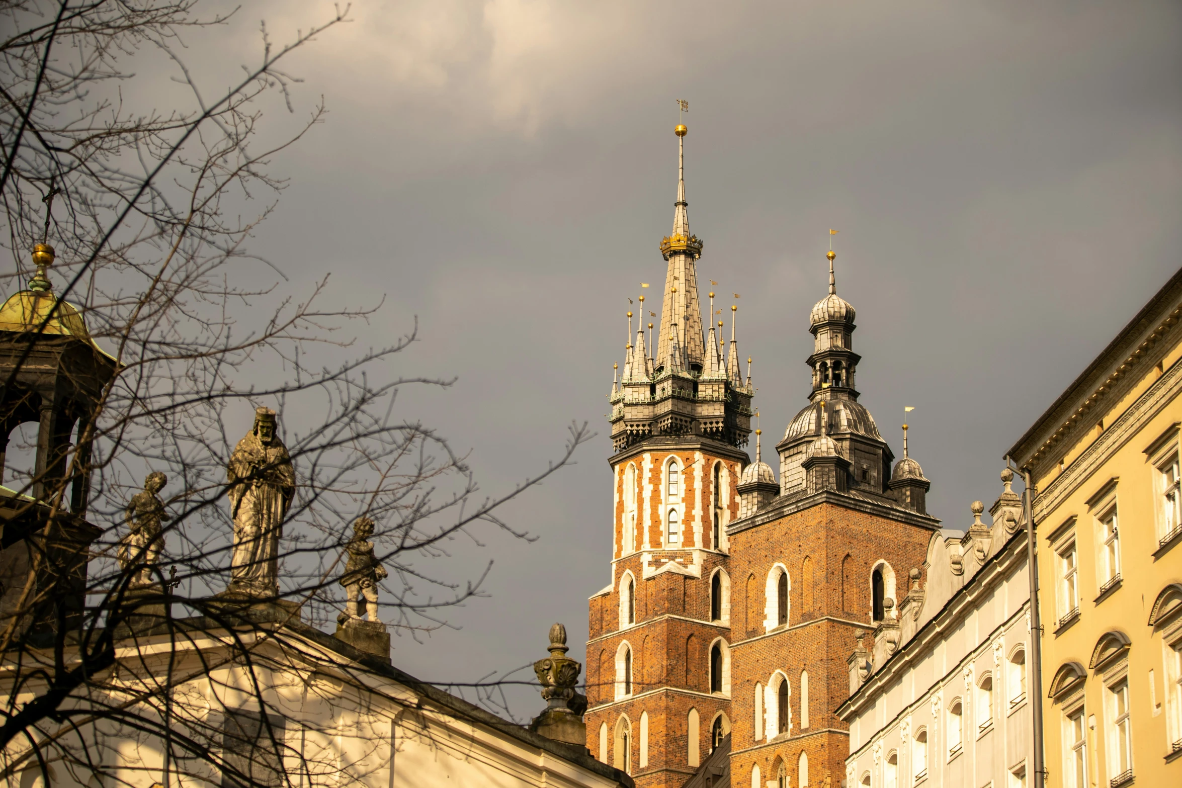 the tall building has spires in front of it