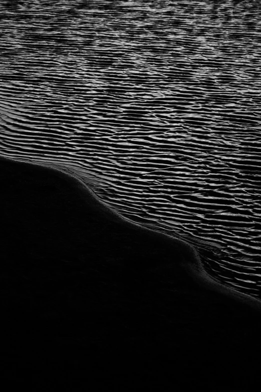 a large wave in the middle of some water