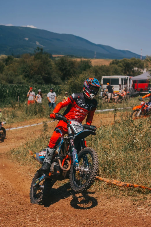 a man riding on the back of a dirt bike