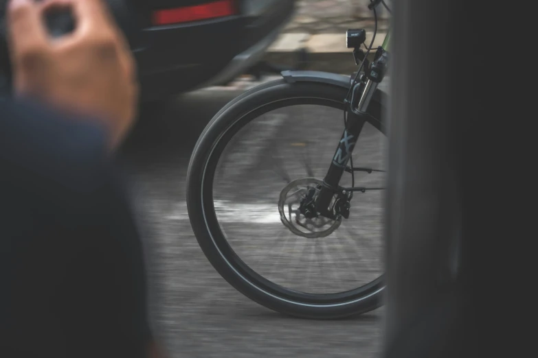 a bicycle with the front wheel on the street