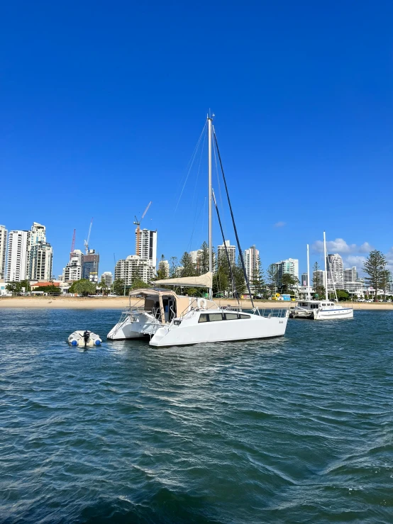 boats are in the ocean near an city