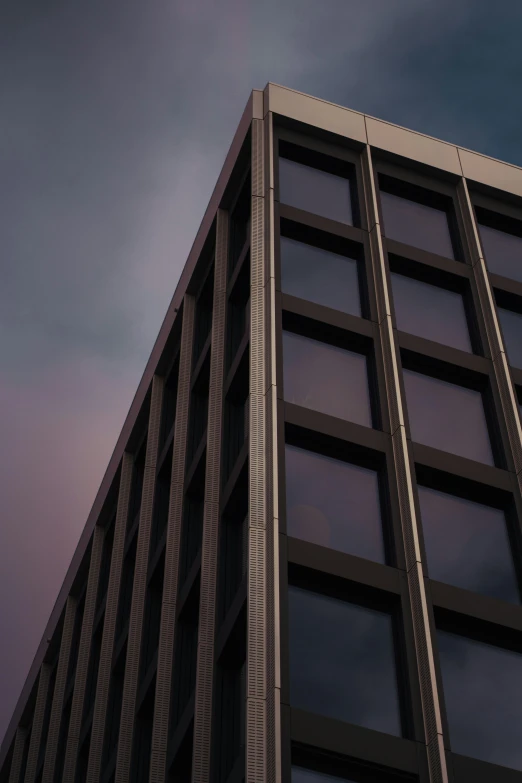 a plane flies close to the side of a high rise building