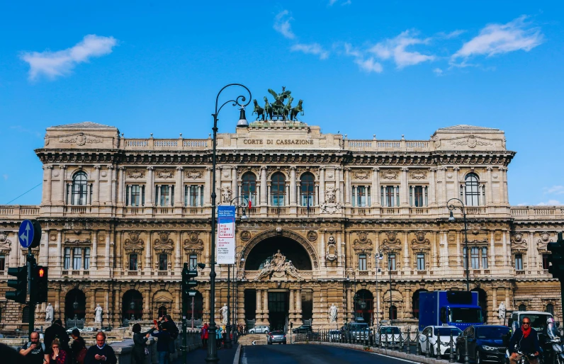 this is an ornate, old building with a statue on top