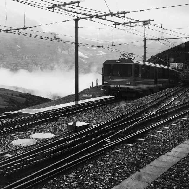 a black and white po of a train on tracks