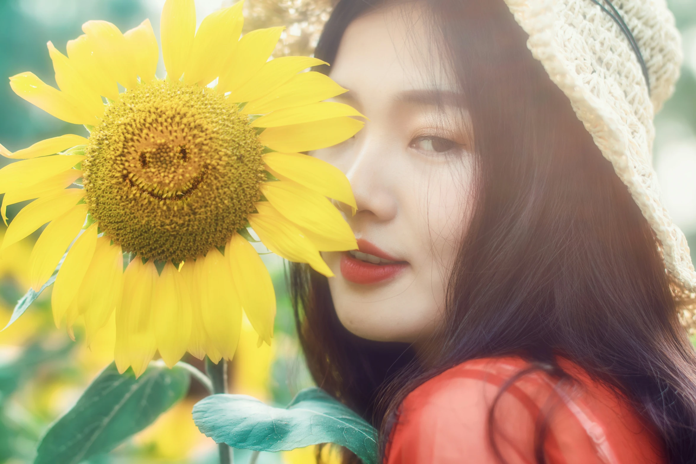 an image of a woman holding a sunflower