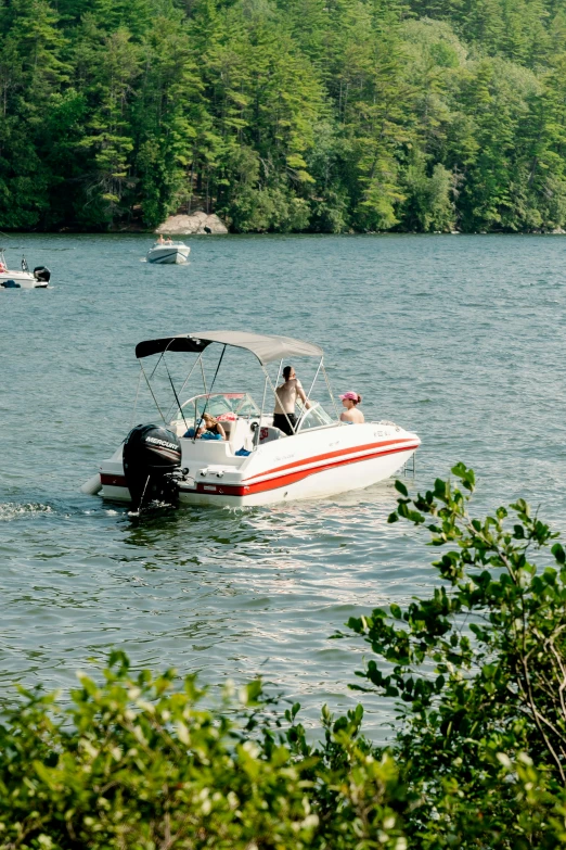 several boats are on the water near the shore