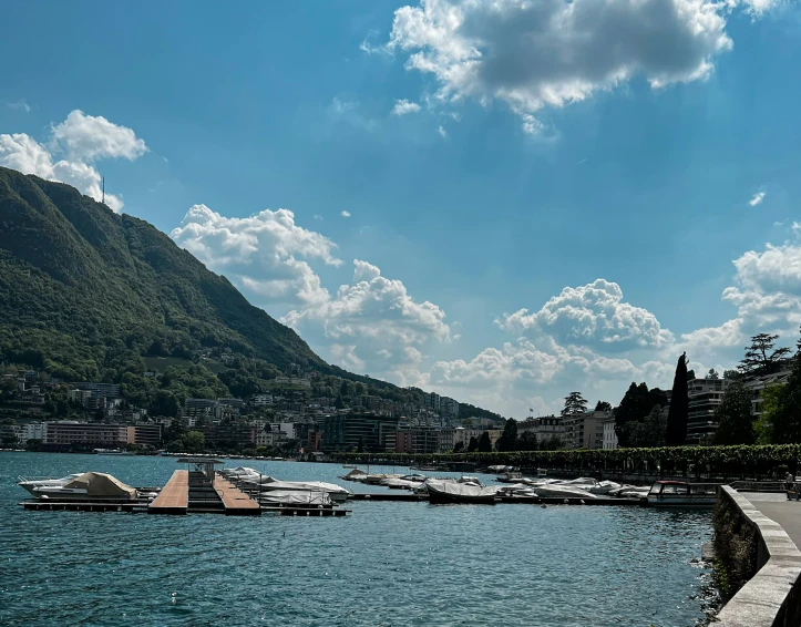 a large body of water with boats next to it